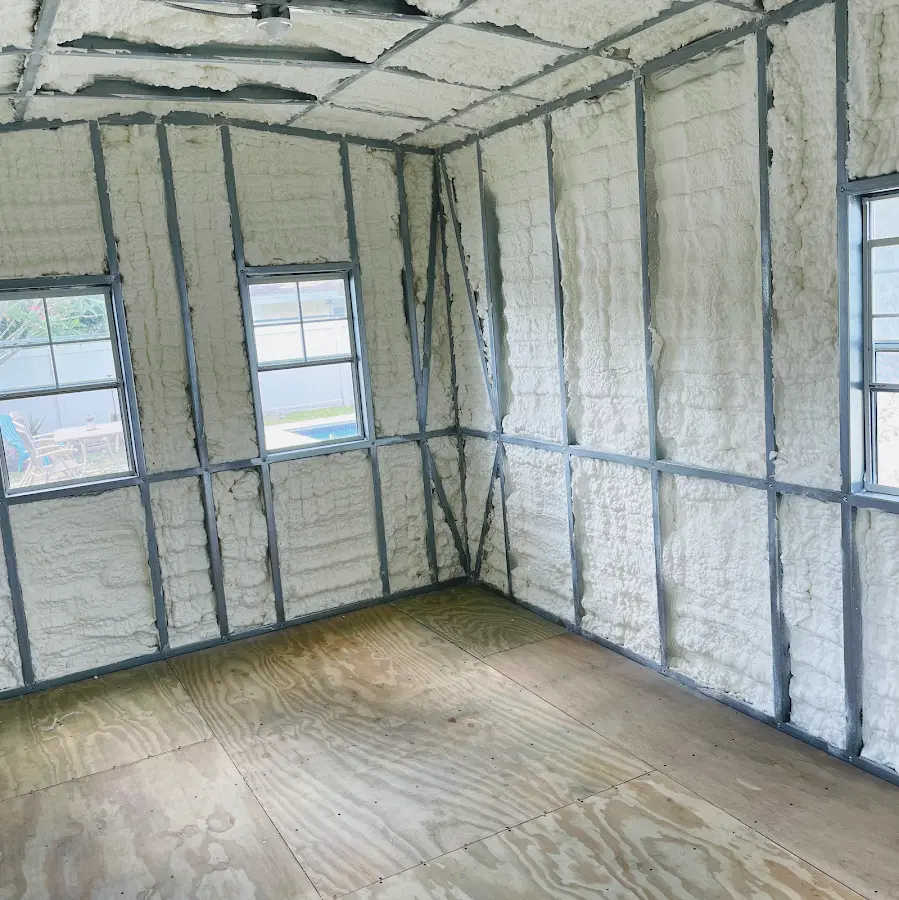 Closed-cell spray foam insulation applied to wall cavities in a residential project in Elma